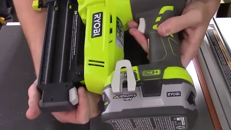 Close-up of the Ryobi P320 showing the nail magazine being opened.