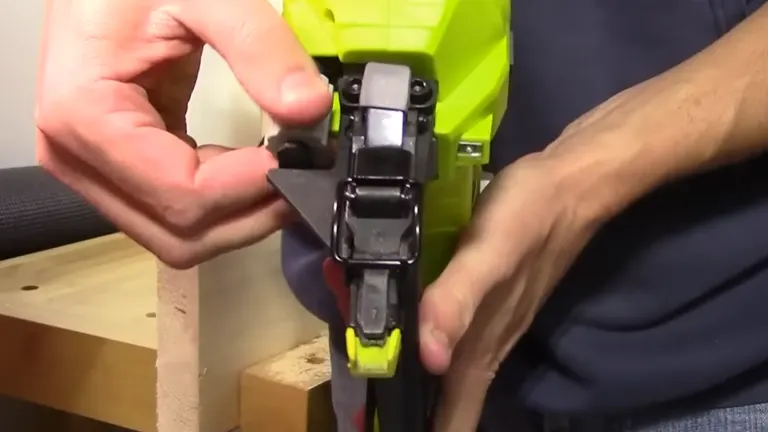 Close-up of adjusting the settings on the Ryobi P320 Airstrike Brad Nailer.