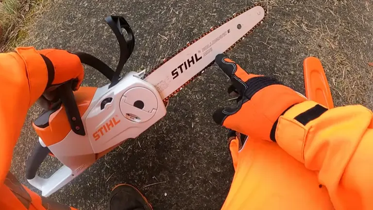 Person with PPE pointing the chain of the STIHL MSA 70 C-B Cordless Chainsaw