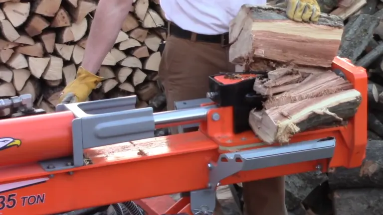 Person using the Yardmax 35 Ton Log Splitter splitting logs