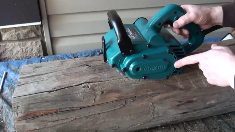 Makita 9741 Wheel Sander being demonstrated on an old wooden log.