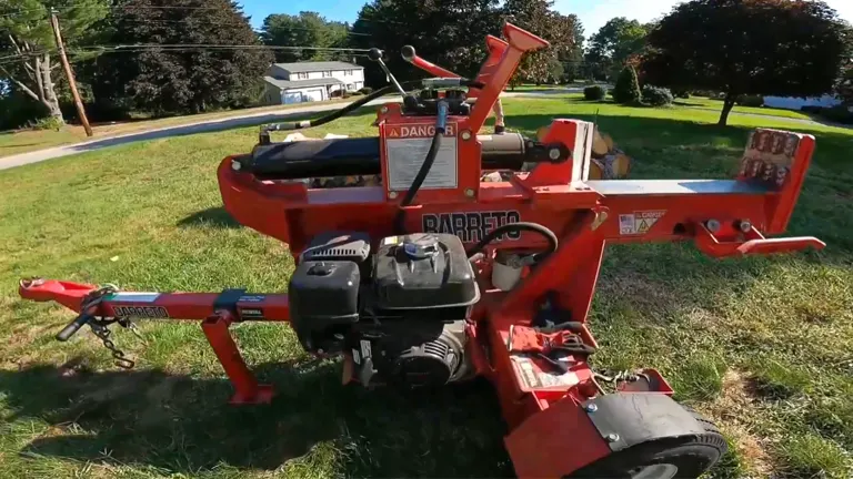 Barreto 920LSH Log Splitter parked on grass with control panel visible and residential neighborhood in the background.
