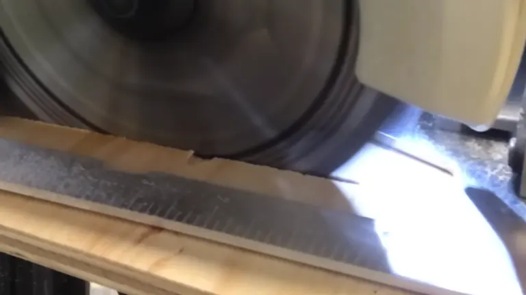 Person operating a circular saw, cutting through a wooden board on a bench.