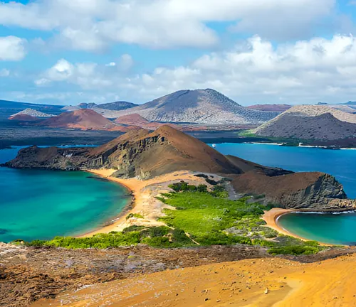 Scenic island with volcanic landscapes and turquoise waters.