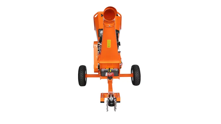 Rear view of the POWER KING wood chipper, highlighting the tow hitch and dual large wheels, with a clear view into the orange hopper and discharge chute.