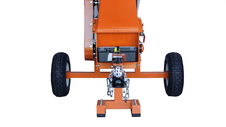 Detailed view of the rear end of the POWER KING wood chipper, showing the hitch mechanism and labeling, focused on the sturdy construction and towing setup.