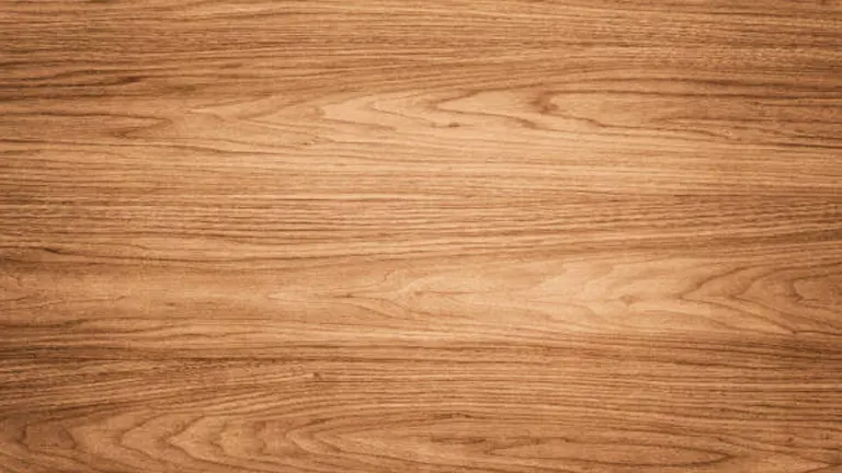 Close-up of light brown wood grain texture with natural patterns.