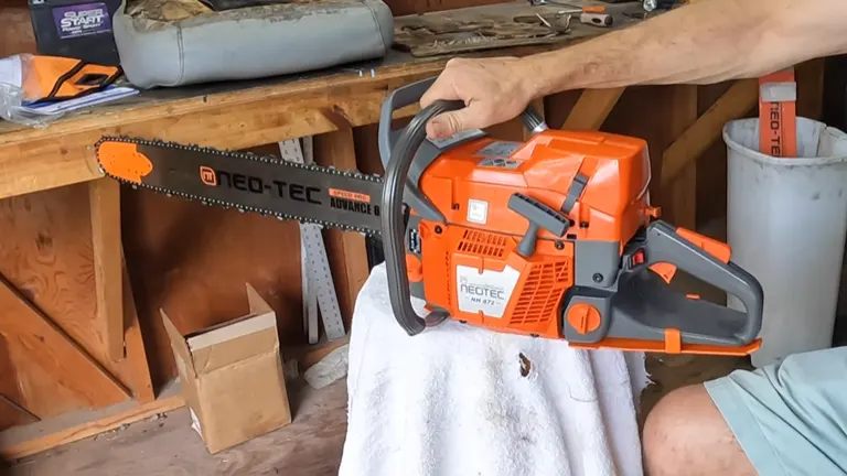 Person holding a NEO-TEC NH872 chainsaw, displayed on a workshop table.