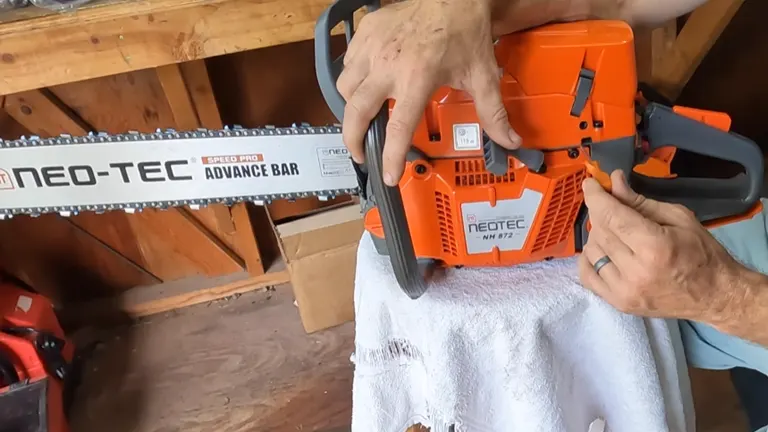 Close-up of a person adjusting the NEO-TEC NH872 chainsaw's settings.