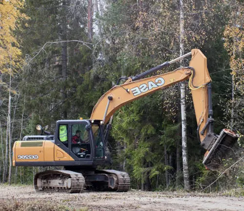 Mulcher machine clearing vegetation by grinding it into mulch, essential for land clearing and site preparation.