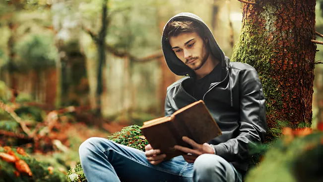 A person reading a forestry books, surrounded by a serene forest environment.