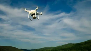 Drone flying in the air over forest