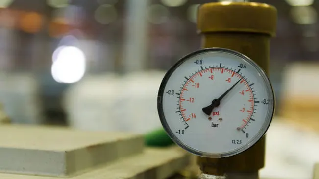 Pressure gauge monitoring moisture levels during the wood drying process to ensure optimal conditions.