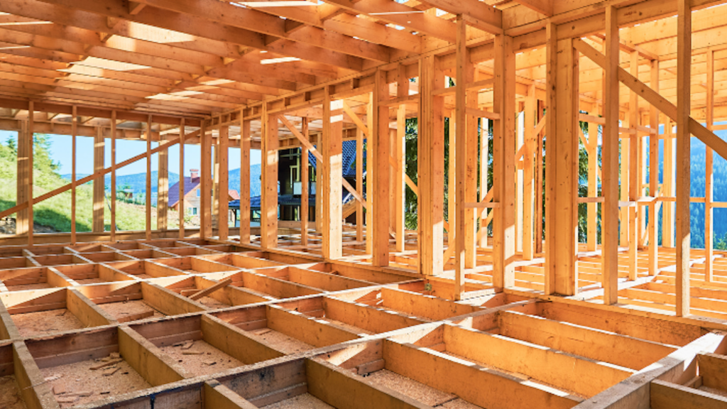 Wooden framework of a building under construction, showcasing timber's investment value.