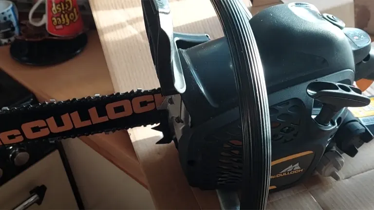 Close-up of McCulloch CS 35S Petrol Chainsaw on a box.