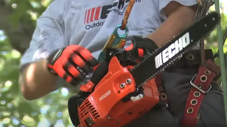 Arborist using Echo CS-355T chainsaw while climbing, emphasizing its portability and top-handle design for tree care.