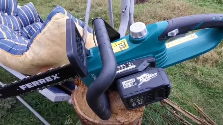 Ferrex electric chainsaw resting on a cut tree stump.